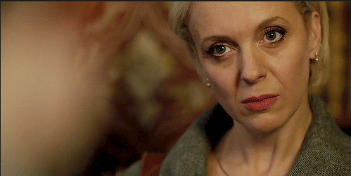 Mary Watson serious expression head tilted slightly to side.