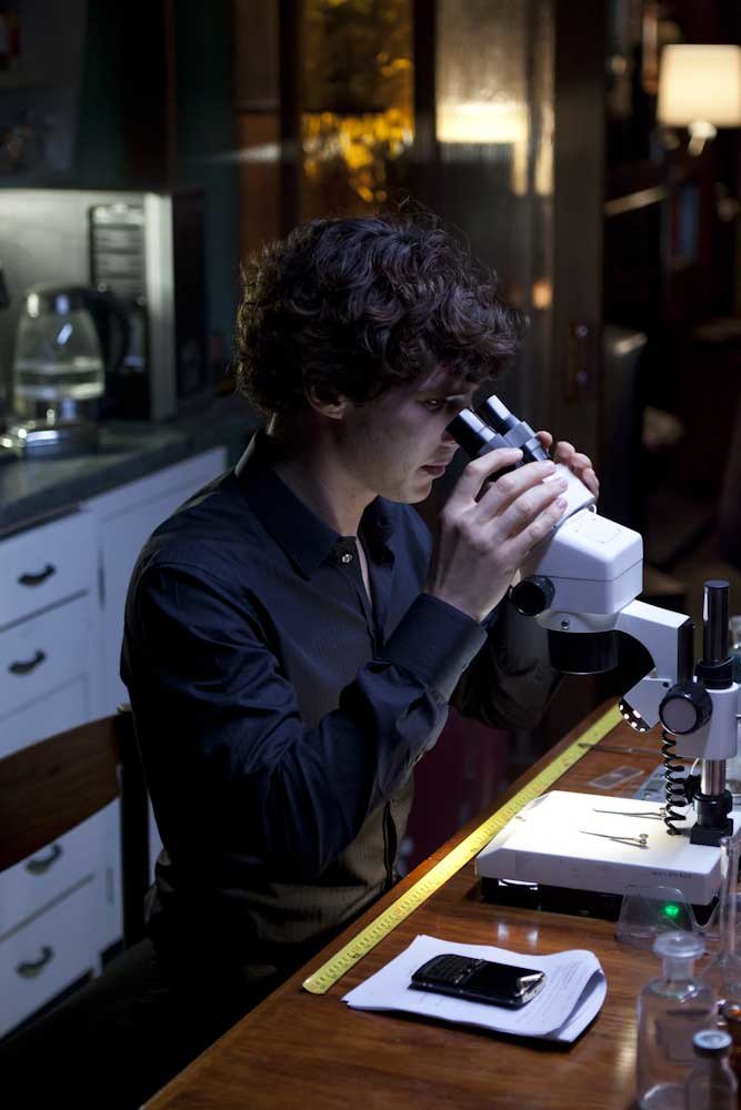 Sherlock using microscope at home