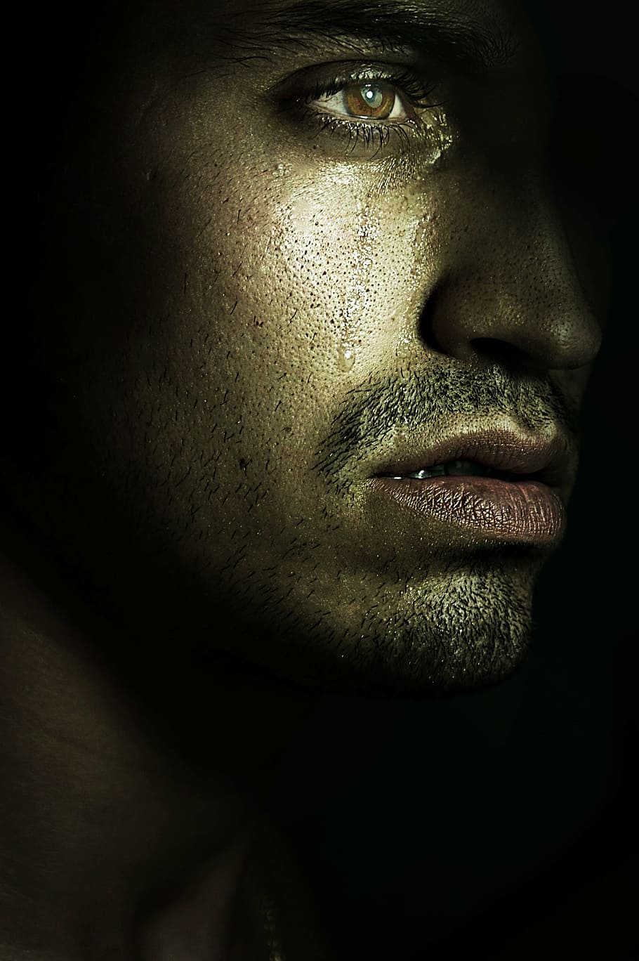 Image of man crying in sepia tone