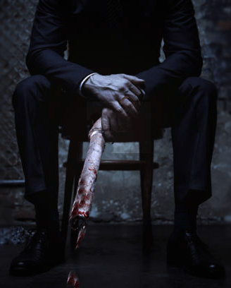 man holding bloodied pipe