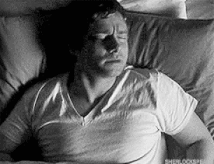 Watson licking lip in sleep.