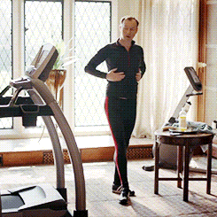 Mycroft in home gym rubbing belly