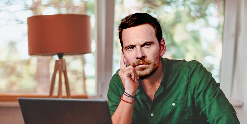 An angry Sebastian Moran, sitting at a laptop